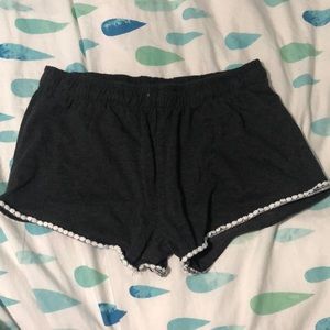 Size LG (14/16 girls) pair of dark grey shoes with a white trim